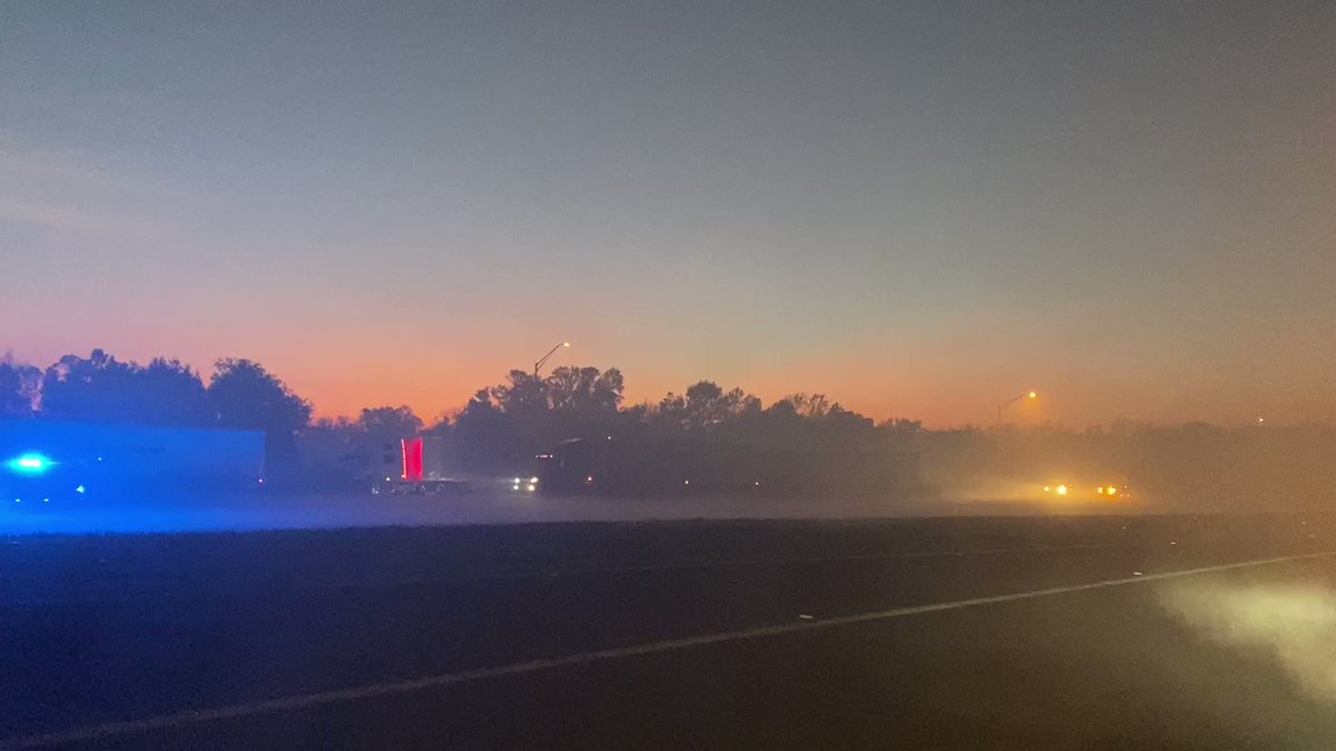 other scene of the accident where we can see several totaled semi trucks on the northbound side of I-95. A hazmat team is coming in next. Visibility from fog and smoke is still poor.