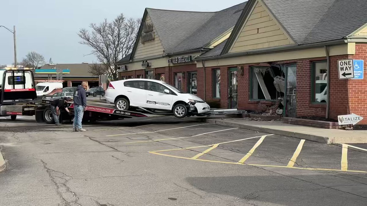 Car crashed in building in Brighton at Monroe and Clover. The driver of the car was taken to the hospital with minor injuries. No one was inside the building. The car seems to belong to a collision center.