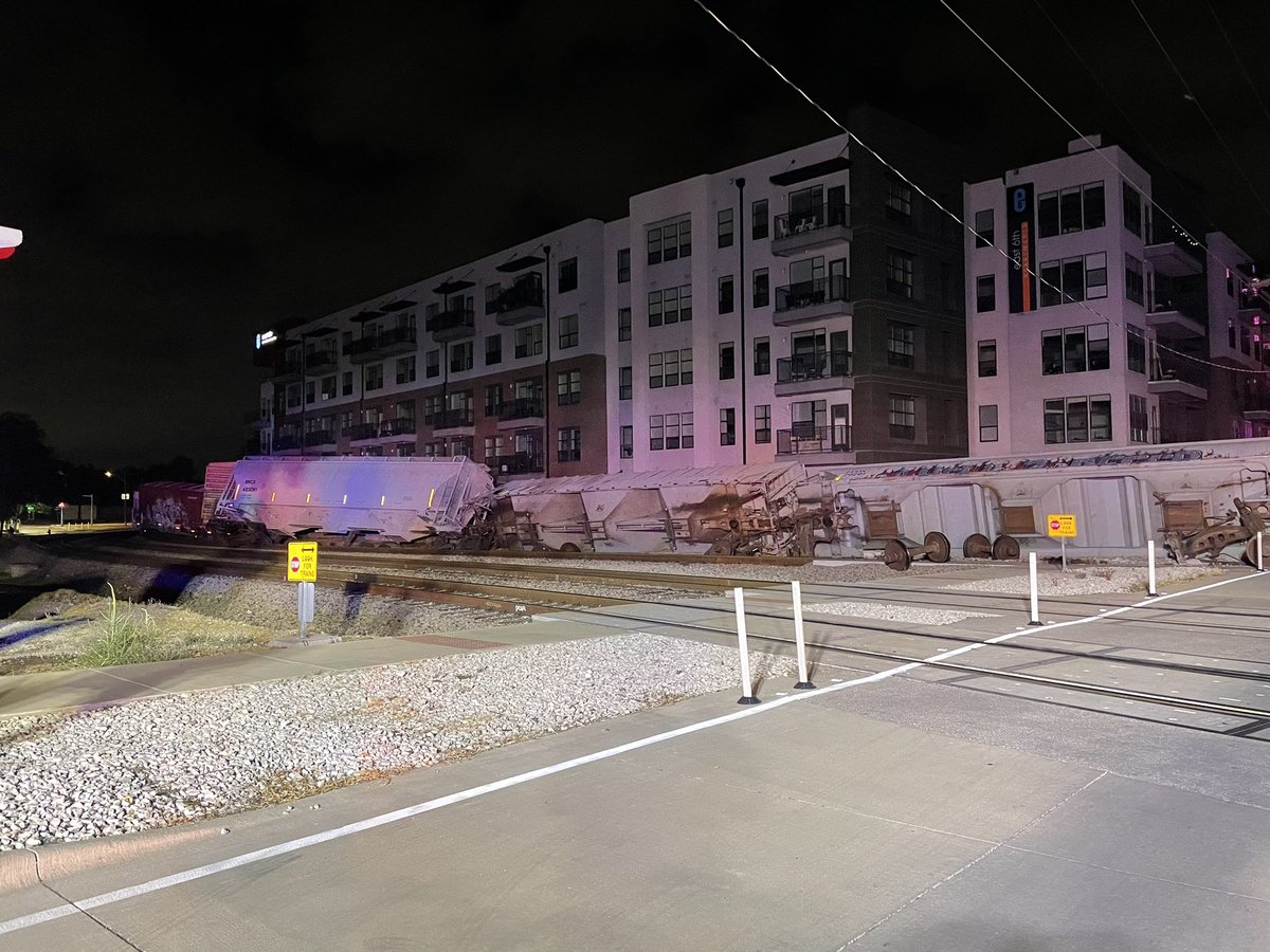 AFD, APD and ATEMS onscene of a train derailment near E 6th St and Robert T Martinez Jr St. 7 train cars turned over - 2  cars contain gravel, 5 cars are empty. No injuries. No hazardous materials. No structures involved. Total train car length is 90 cars