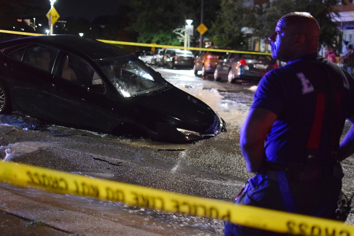 Firefighters were initially sent to 3436 Chesterfield Avenue to investigate a report of a vehicle accident with entrapment. When they arrived at the location, they found a car that had been partially swallowed by a sinkhole
